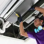 we will fix it employee cleaning the ac coil