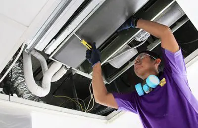 we will fix it employee cleaning the ac coil