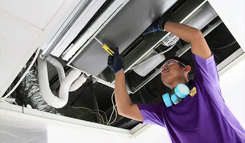 we will fix it employee cleaning the ac coil