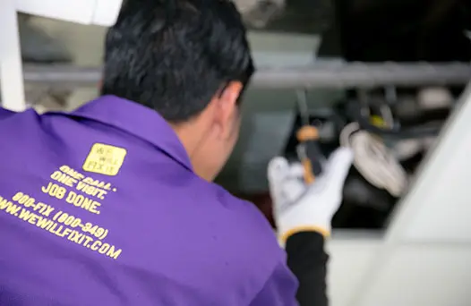 We will fix it employee servicing air conditioner unit