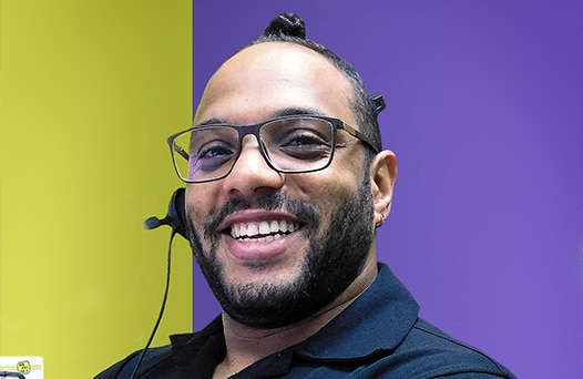 Man smiling wearing a headset