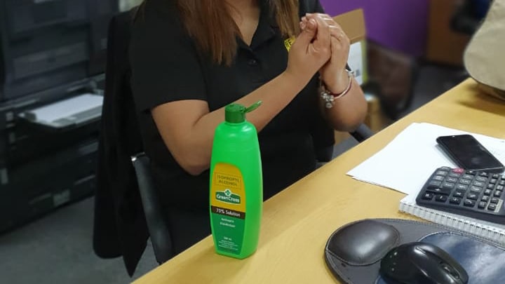 Woman cleaning hands with sanitizer disinfectant