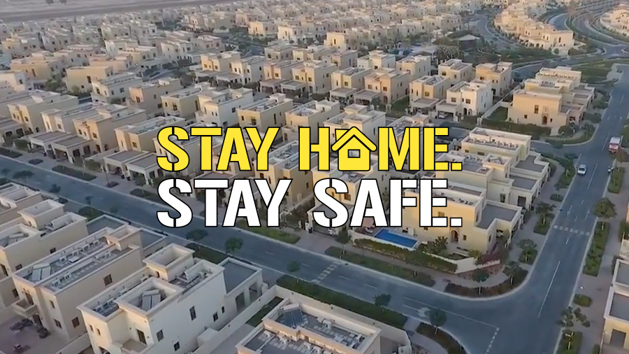 Stay home stay safe label with houses in background