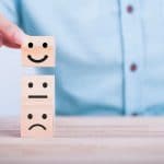 Man moving smiling face blocks