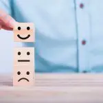 Man moving smiling face blocks
