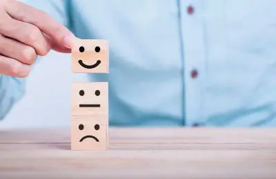 Man moving smiling face blocks