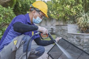 Man cleaning AC ducts