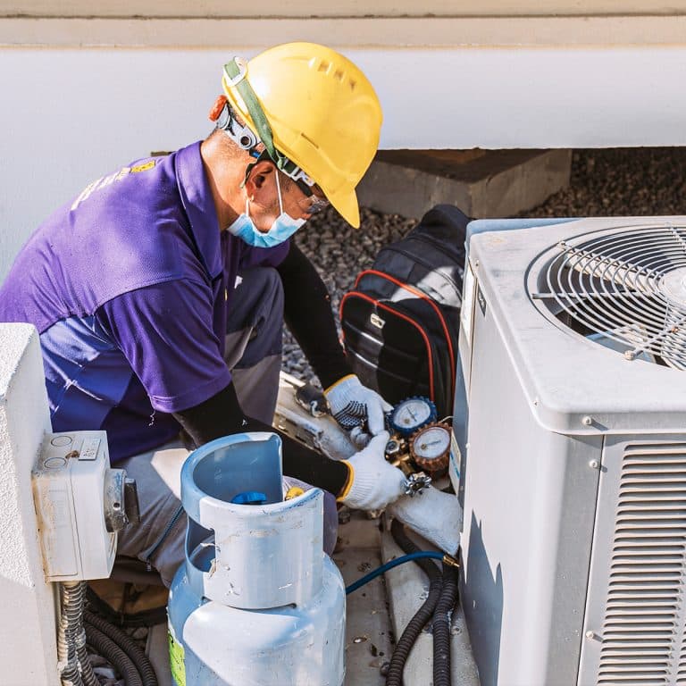 Technician performing maintenance services