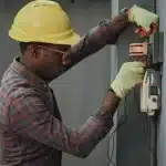 Electrician repairing an electrical socket