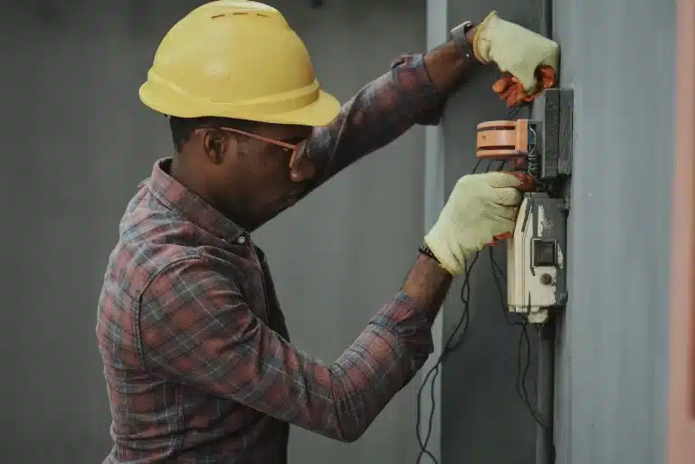 Electrician repairing an electrical socket