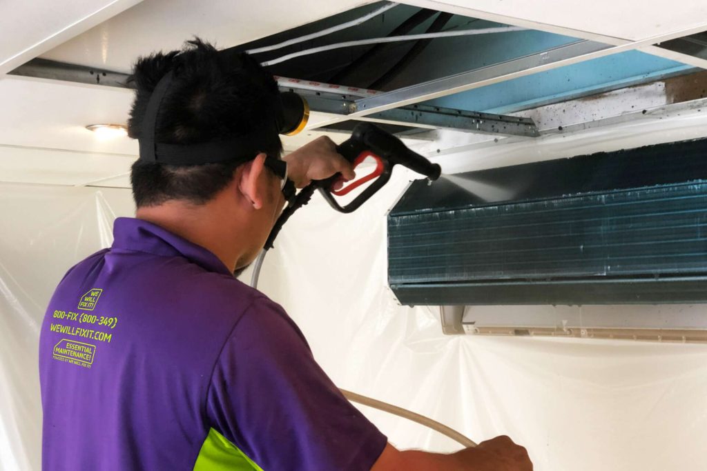 Tech Cleaning An Ac Coil