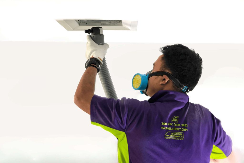 Tech Cleaning An Ac Duct