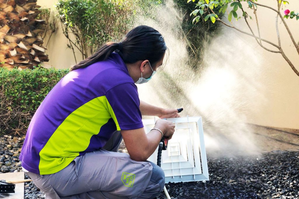 Tech Cleaning Vent Outside