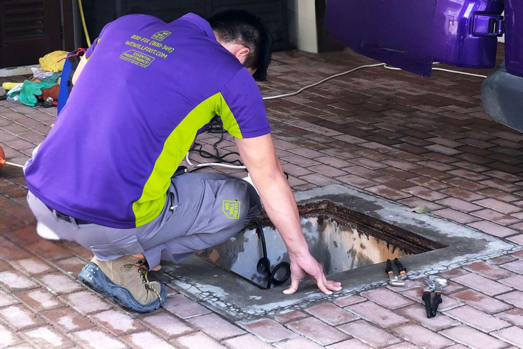 Tech Looking Over Water Tank