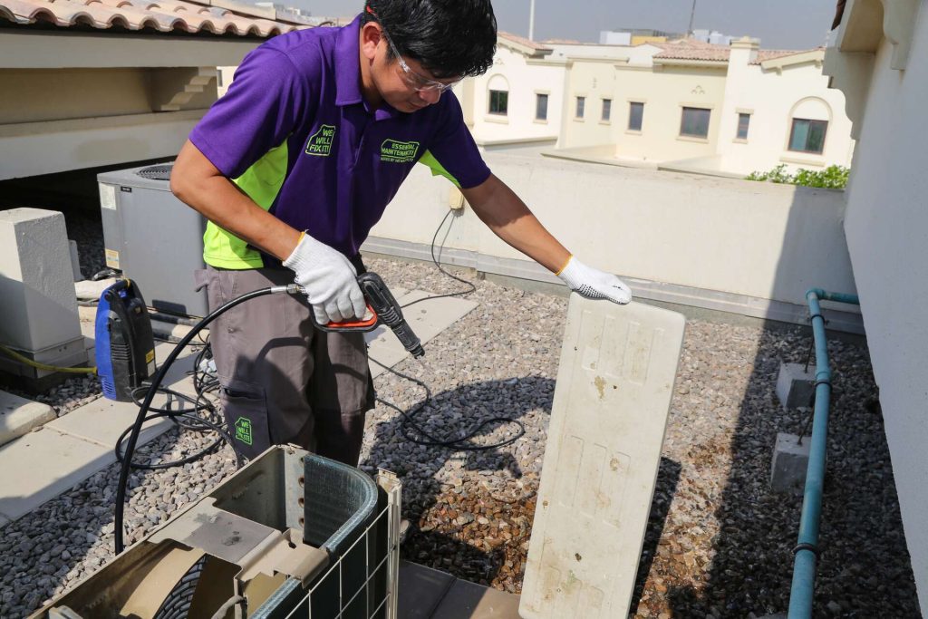 Tech On Roof Servicing Ac