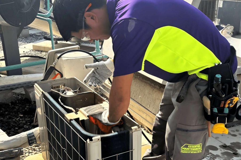 Tech On Roof Servicing Ac