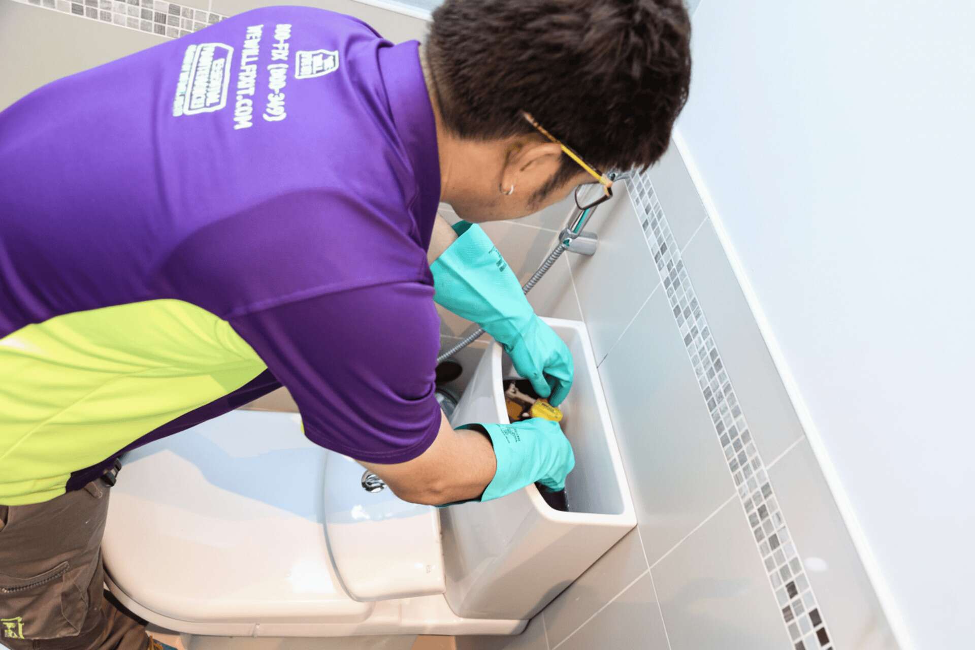 Tech Over An Open Toilet Cistern