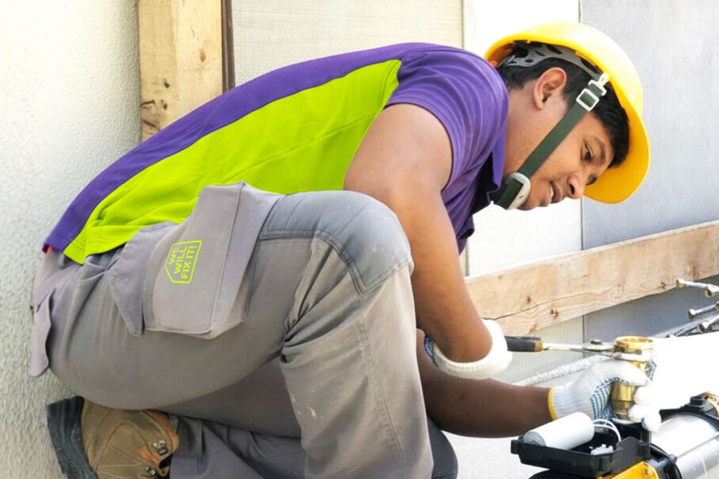 Tech Using A Wrench On Pipework
